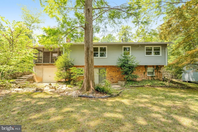 2306 Marline Ct, Woodbridge, VA 22192 - view of front of home featuring a sunroom, a front lawn, and brick siding