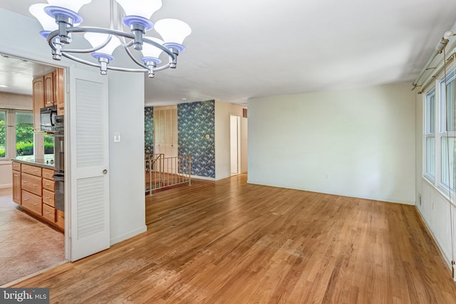 2306 Marline Ct, Woodbridge, VA 22192 - unfurnished room with a chandelier and light wood-style flooring