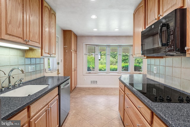 2306 Marline Ct, Woodbridge, VA 22192 - kitchen featuring black appliances, a sink, baseboards, dark stone countertops, and decorative backsplash
