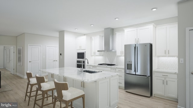 23640 Bolton Crescent Ter Unit 13-306, Ashburn, VA 20148 - kitchen with stainless steel fridge with ice dispenser, a sink, wall chimney exhaust hood, light wood-style floors, and white cabinets