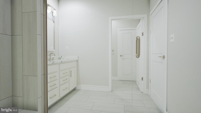 23640 Bolton Crescent Ter Unit 13-306, Ashburn, VA 20148 - full bathroom with double vanity and baseboards