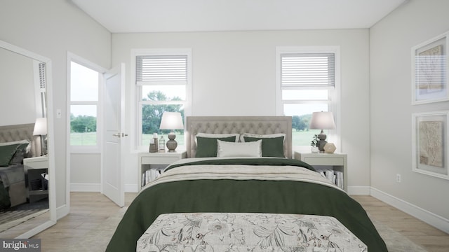 23640 Bolton Crescent Ter Unit 13-306, Ashburn, VA 20148 - bedroom with multiple windows, light wood-style floors, and baseboards