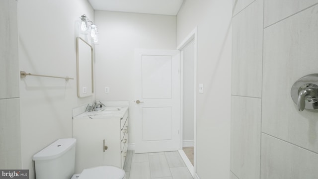 23640 Bolton Crescent Ter Unit 13-306, Ashburn, VA 20148 - bathroom with vanity, toilet, and tile patterned flooring