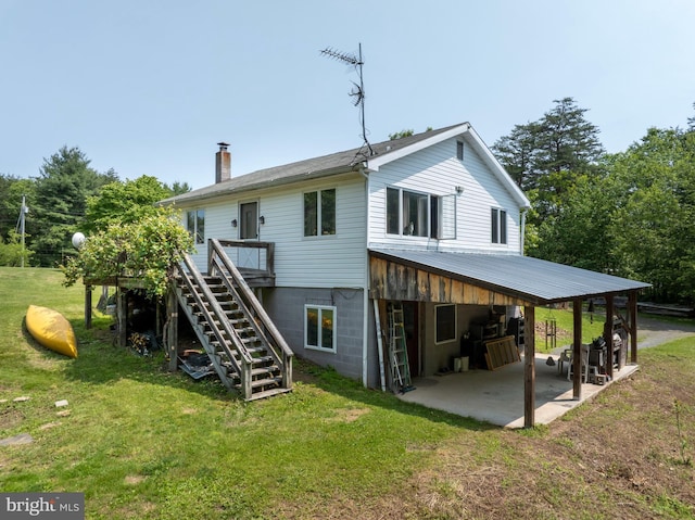 10496 Red Hawk Ln, Huntingdon, PA 16652 - rear view of house featuring a lawn, stairway, a chimney, a patio, and a deck