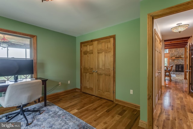 2020 Quaint Acres Ln, Berkeley Springs, WV 25411 - office with wood finished floors, baseboards, and a fireplace