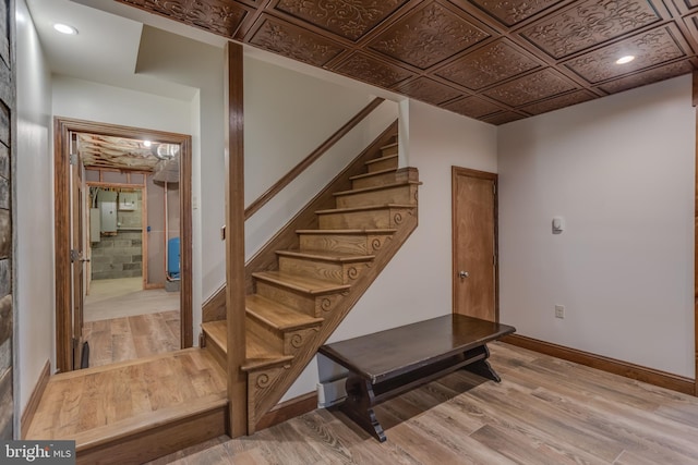 2020 Quaint Acres Ln, Berkeley Springs, WV 25411 - stairs with wood finished floors, baseboards, and an ornate ceiling