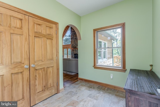 2020 Quaint Acres Ln, Berkeley Springs, WV 25411 - foyer with plenty of natural light, baseboards, and a fireplace