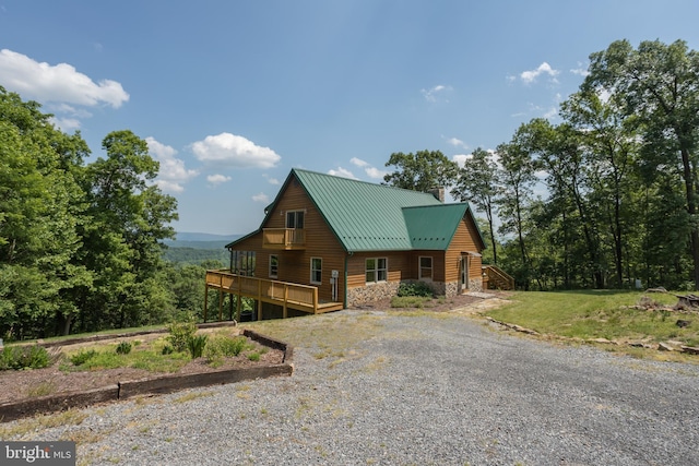 2020 Quaint Acres Ln, Berkeley Springs, WV 25411 - chalet / cabin with a wooden deck, a chimney, metal roof, stone siding, and driveway