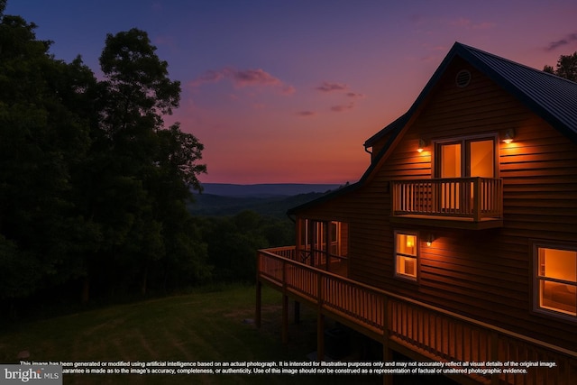 2020 Quaint Acres Ln, Berkeley Springs, WV 25411 - back of house at dusk featuring a balcony, a lawn, and a deck