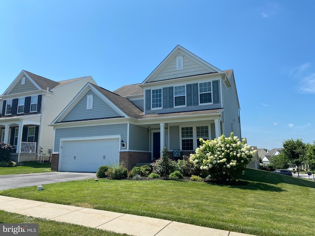 614 Empire Dr, Downingtown, PA 19335 - view of front of house with driveway, a porch, a front yard, and an attached garage