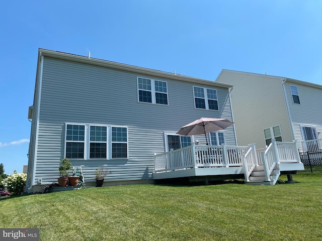 614 Empire Dr, Downingtown, PA 19335 - back of property featuring a wooden deck and a lawn