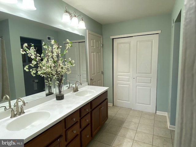 614 Empire Dr, Downingtown, PA 19335 - bathroom featuring double vanity, tile patterned floors, and baseboards