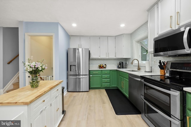 8170 Sinclair Mill Rd, Manassas, VA 20112 - kitchen featuring stainless steel appliances, a sink, wood counters, tasteful backsplash, and recessed lighting