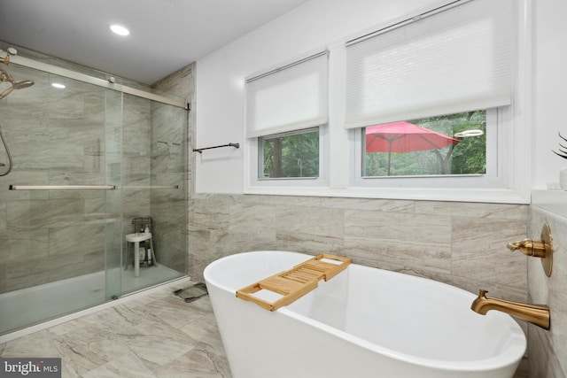 8170 Sinclair Mill Rd, Manassas, VA 20112 - bathroom featuring a stall shower, a freestanding bath, tile walls, recessed lighting, and marble finish flooring