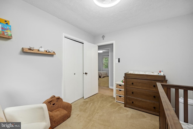 8170 Sinclair Mill Rd, Manassas, VA 20112 - bedroom with light colored carpet, a textured ceiling, and a closet