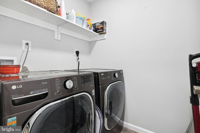 8170 Sinclair Mill Rd, Manassas, VA 20112 - laundry area with washing machine and dryer and baseboards