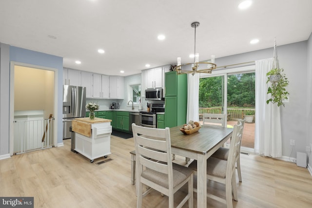 8170 Sinclair Mill Rd, Manassas, VA 20112 - dining area featuring recessed lighting, light wood-style flooring, a chandelier, and baseboards