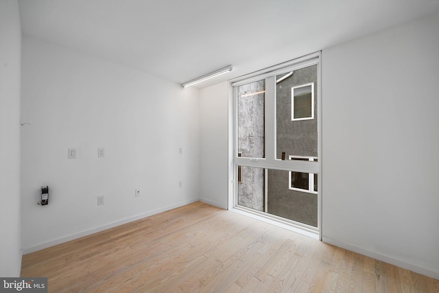 2710 W Harper St, Philadelphia, PA 19130 - spare room featuring wood finished floors and baseboards