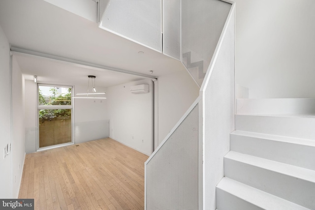 2710 W Harper St, Philadelphia, PA 19130 - staircase featuring wood-type flooring and a wall unit AC