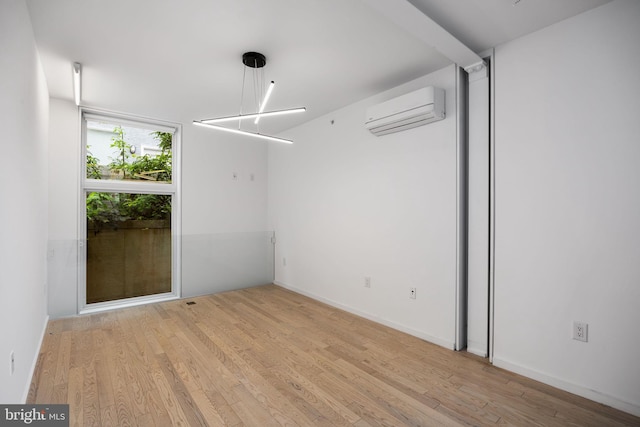 2710 W Harper St, Philadelphia, PA 19130 - unfurnished room with a wall mounted air conditioner and wood finished floors