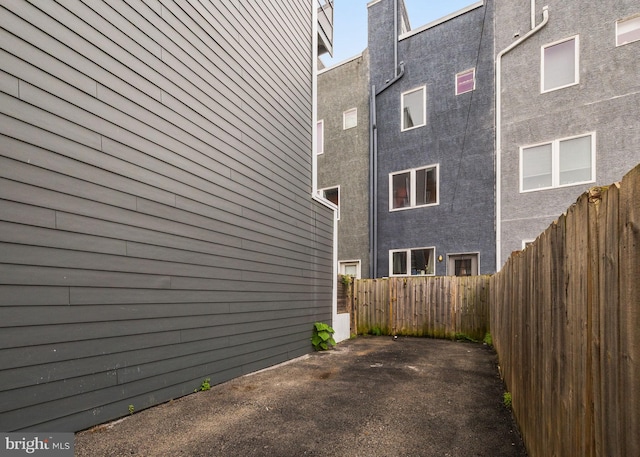 2710 W Harper St, Philadelphia, PA 19130 - view of side of home with a fenced backyard, stucco siding, and a patio area