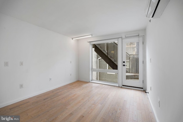 2710 W Harper St, Philadelphia, PA 19130 - unfurnished room featuring light wood-style flooring and a wall mounted air conditioner