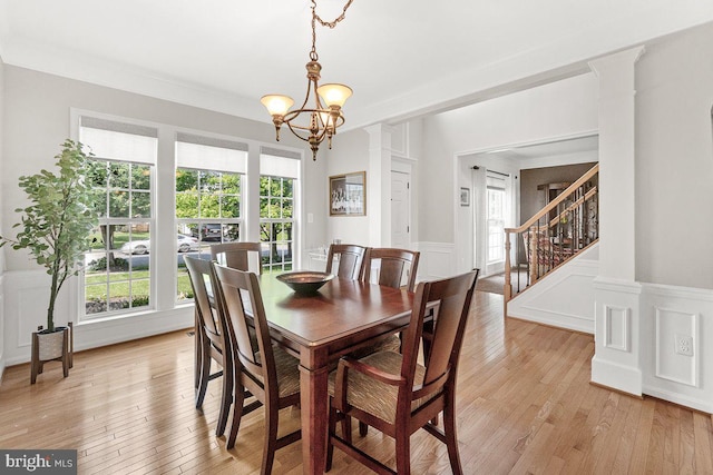 202 Galyn Dr, Brunswick, MD 21758 - dining space with plenty of natural light, a wainscoted wall, light wood-style floors, a decorative wall, and stairway