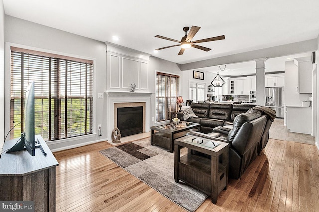 202 Galyn Dr, Brunswick, MD 21758 - living area with ceiling fan, light wood-style floors, a fireplace with raised hearth, recessed lighting, and baseboards