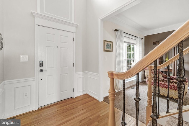 202 Galyn Dr, Brunswick, MD 21758 - foyer entrance with a decorative wall, light wood-style floors, a wainscoted wall, ornamental molding, and stairway
