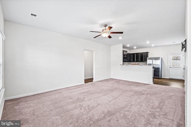 17324 Mary Adams Ave, Bowling Green, VA 22427 - unfurnished living room featuring dark colored carpet, ceiling fan, baseboards, and recessed lighting