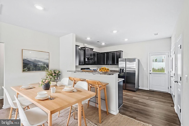 17324 Mary Adams Ave, Bowling Green, VA 22427 - kitchen with stainless steel fridge with ice dispenser, dark cabinetry, a peninsula, dark wood-style flooring, and recessed lighting