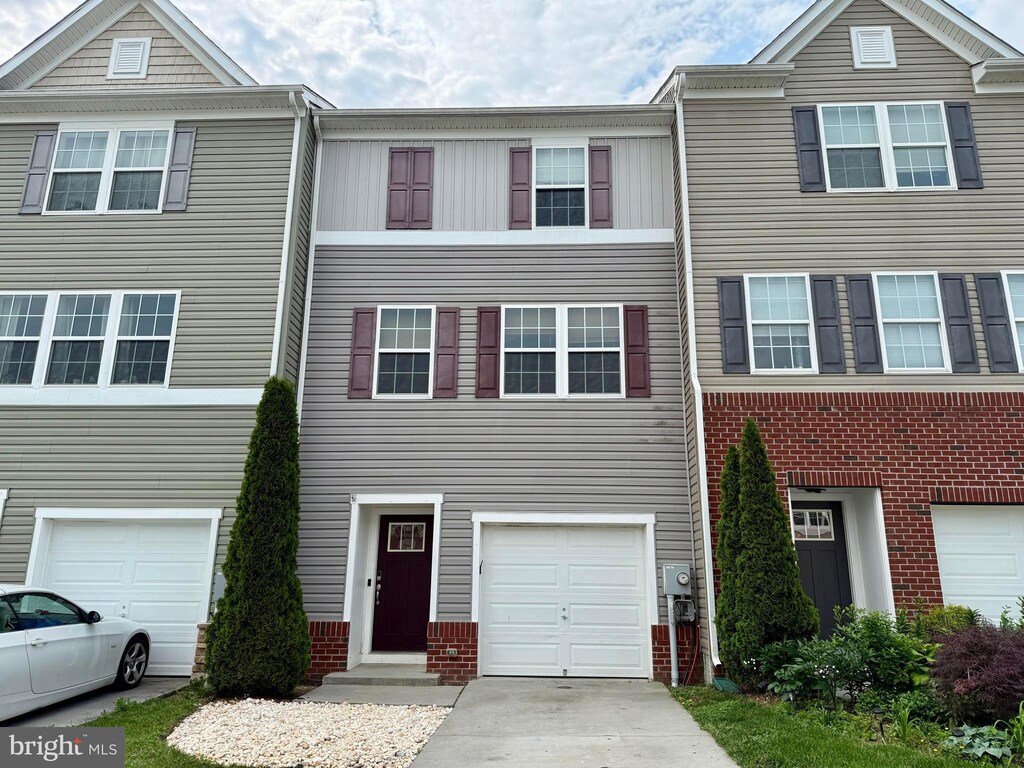 138 Drexel Ct, Martinsburg, WV 25404 - multi unit property with an attached garage, driveway, and brick siding