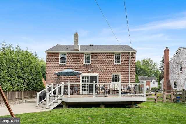 142 Barcladen Rd, Bryn Mawr, PA 19010 - rear view of house featuring brick siding, a wooden deck, a chimney, and a patio