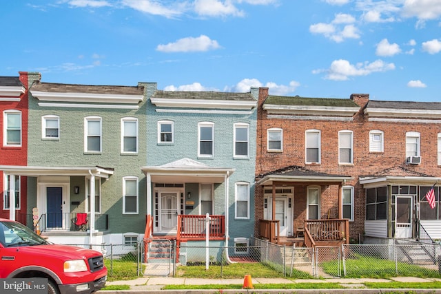 2807 Waldorf Ave, Baltimore, MD 21215 - multi unit property with brick siding, a gate, cooling unit, and a fenced front yard