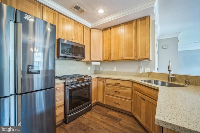 305 S Payne St Unit 305, Alexandria, VA 22314 - kitchen featuring appliances with stainless steel finishes, ornamental molding, a peninsula, dark wood-style floors, and recessed lighting