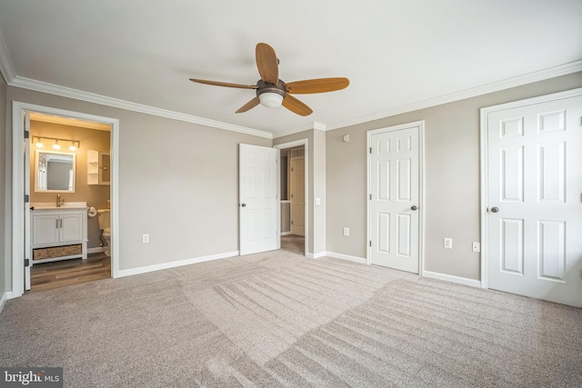 305 S Payne St Unit 305, Alexandria, VA 22314 - unfurnished bedroom featuring carpet flooring, ornamental molding, ensuite bathroom, two closets, and ceiling fan