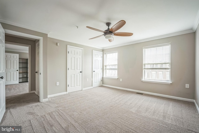 305 S Payne St Unit 305, Alexandria, VA 22314 - unfurnished bedroom with ornamental molding, carpet floors, two closets, and a ceiling fan