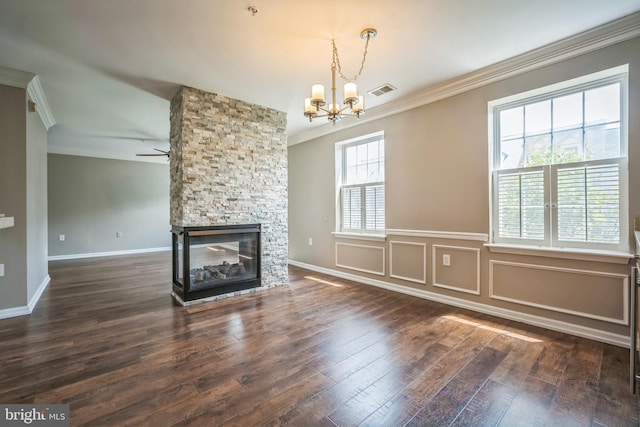 305 S Payne St Unit 305, Alexandria, VA 22314 - unfurnished living room featuring crown molding, a chandelier, wood-type flooring, a fireplace, and ceiling fan