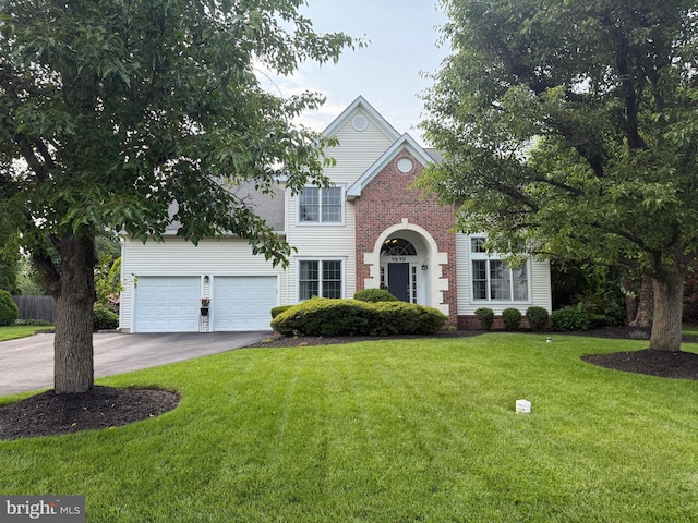 4170 Tersher Dr, Doylestown, PA 18902 - traditional-style home with asphalt driveway, a front yard, and brick siding