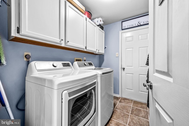 4170 Tersher Dr, Doylestown, PA 18902 - washroom featuring washing machine and clothes dryer, cabinet space, and dark tile patterned flooring