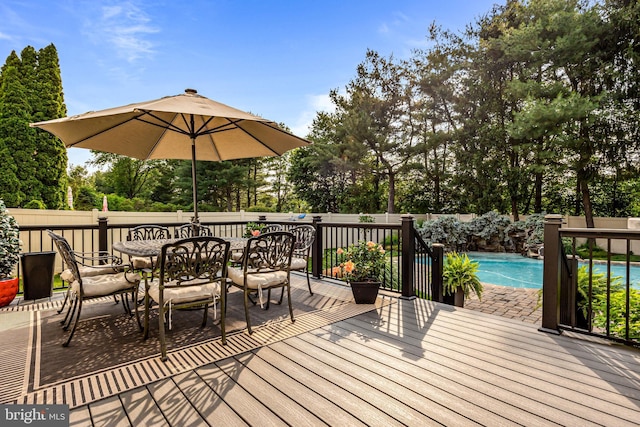 4170 Tersher Dr, Doylestown, PA 18902 - wooden deck with outdoor dining area, a fenced backyard, and view of scattered trees
