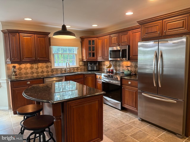4170 Tersher Dr, Doylestown, PA 18902 - kitchen with appliances with stainless steel finishes, a sink, a breakfast bar, hanging light fixtures, and dark stone countertops