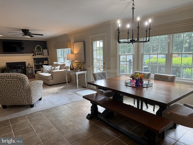 4170 Tersher Dr, Doylestown, PA 18902 - dining space with ornamental molding, a ceiling fan, a chandelier, and a glass covered fireplace