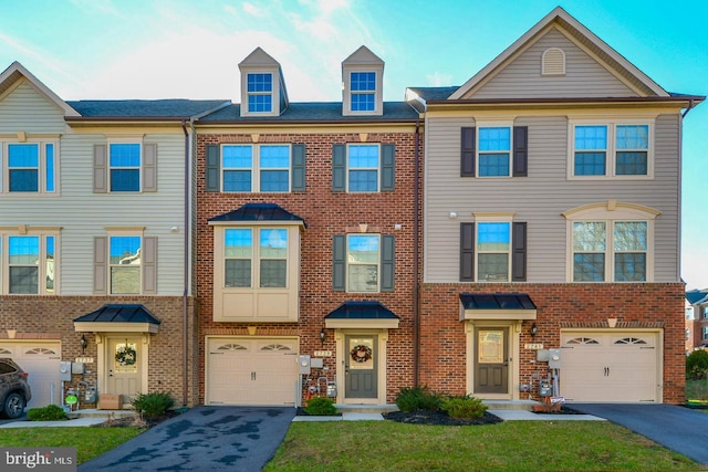 2739 Prospect Hill Dr, Hanover, MD 21076 - townhome / multi-family property featuring driveway, a garage, and brick siding