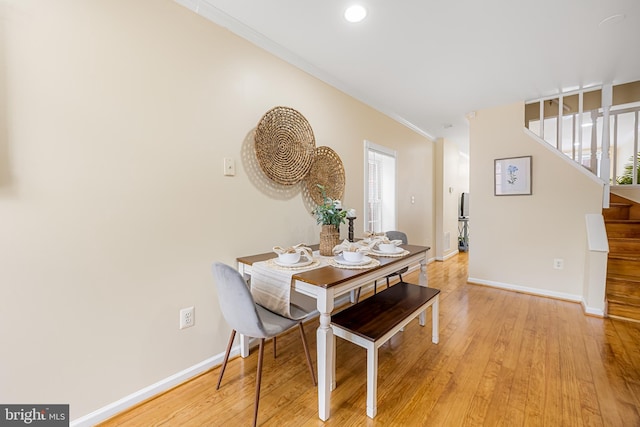 234 E Barney St E, Baltimore, MD 21230 - dining room with stairway, baseboards, ornamental molding, light wood finished floors, and plenty of natural light