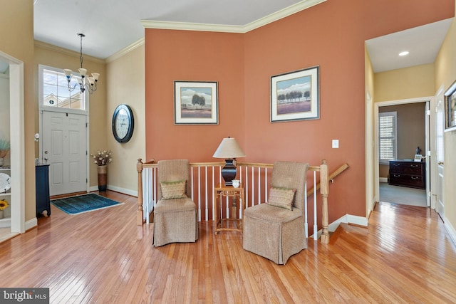 6 Easton Ln, Cinnaminson, NJ 08077 - living area featuring a chandelier, wood-type flooring, an upstairs landing, crown molding, and baseboards