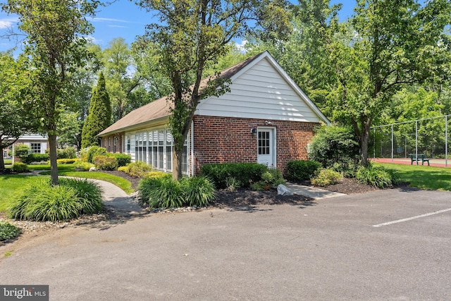 6 Easton Ln, Cinnaminson, NJ 08077 - view of side of property with brick siding and uncovered parking