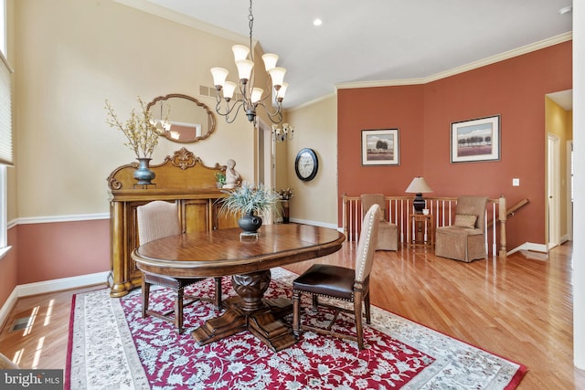 6 Easton Ln, Cinnaminson, NJ 08077 - dining space with wood finished floors, baseboards, crown molding, and a chandelier