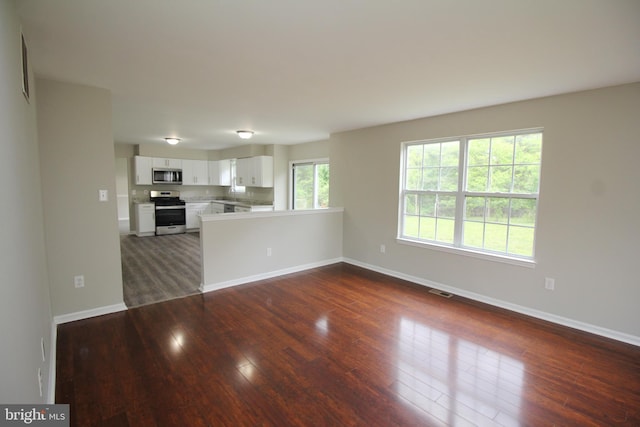 7 E Edgewater Ct, Sicklerville, NJ 08081 - unfurnished living room with dark wood-type flooring and baseboards
