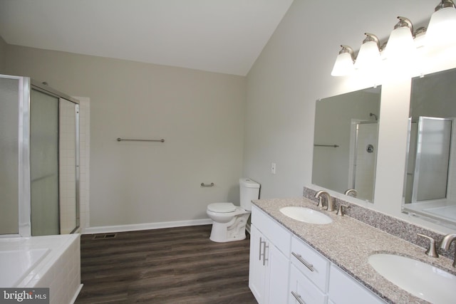 7 E Edgewater Ct, Sicklerville, NJ 08081 - bathroom with a shower stall, double vanity, vaulted ceiling, a bath, and toilet